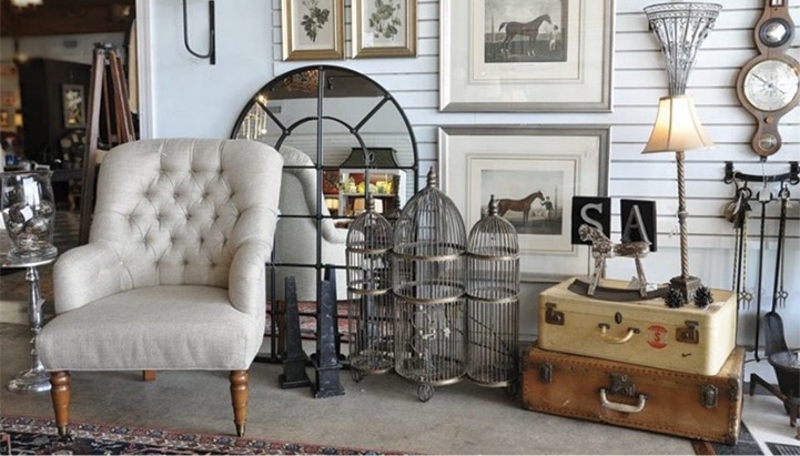 Various furniture and decor near a white wall